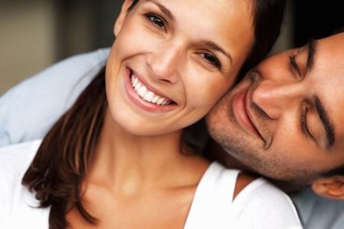 younger couple hugging | lakeville mn dentist